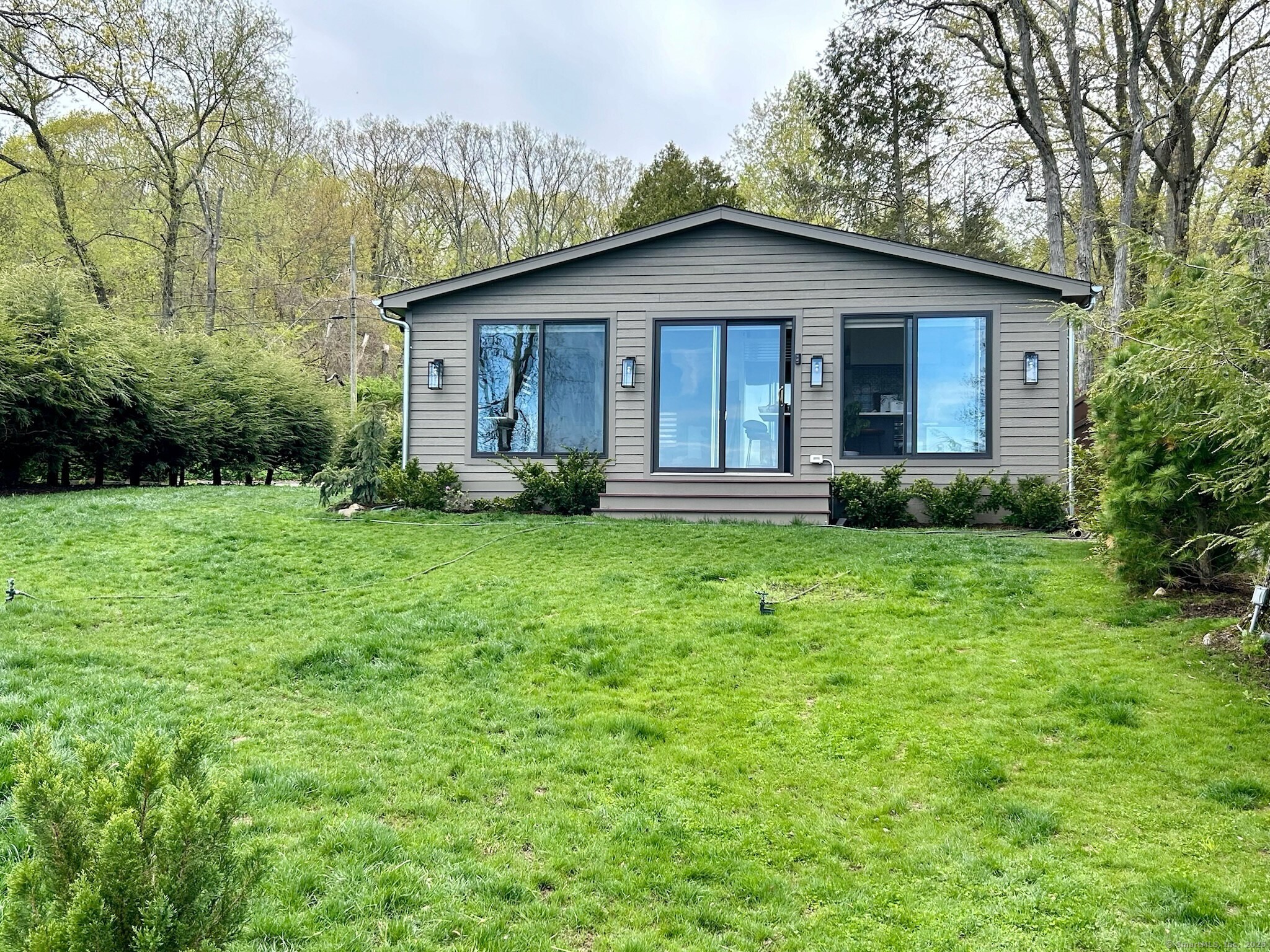 112 West Lake Road, Unit 112 Woodbury, CT 06798 - Photo 9 of 34 a view of a house with yard and green space