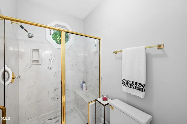 a bathroom with a shower and a shower