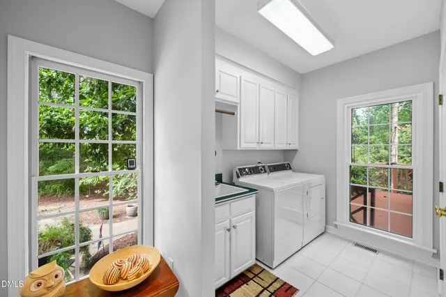 a kitchen with a stove a refrigerator a sink and a window