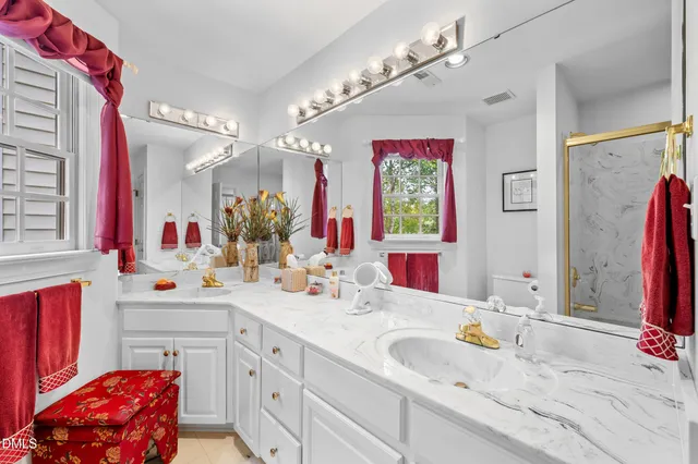 a bathroom with a sink double vanity sink and a mirror