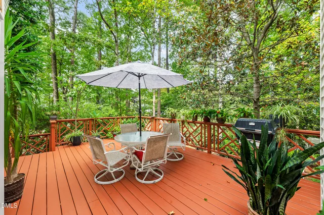 a view of balcony with chairs and wooden floor
