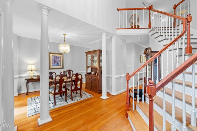 a view of dining room with furniture and wooden floor