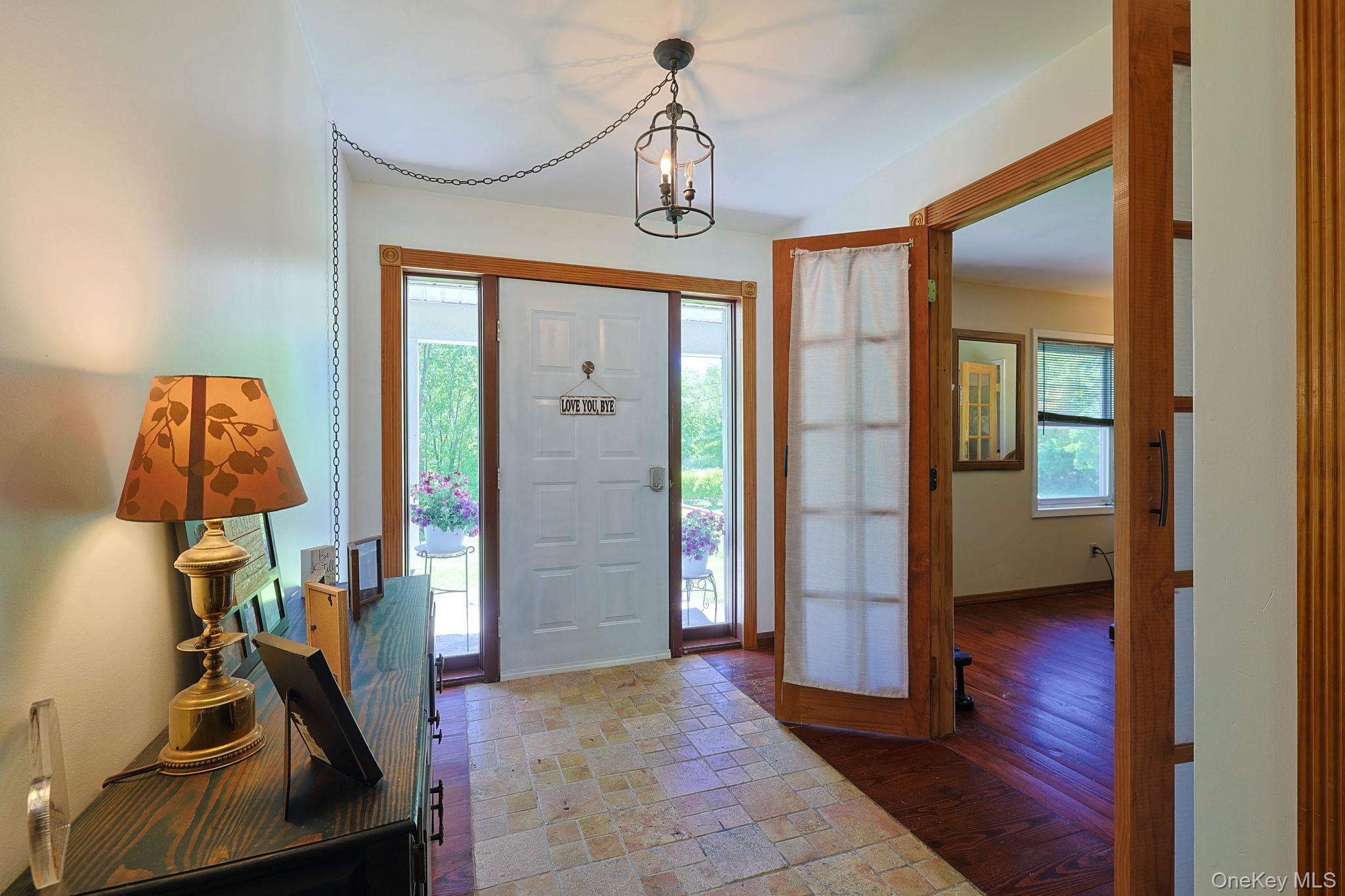 646 County Rte 93 Slate Hill, NY 10973 - Photo 2 of 21 Foyer with a paneled entry door and tile floor,