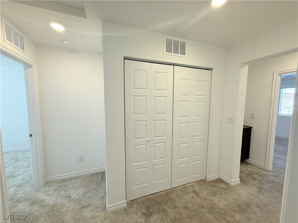10772 Astell Isle Court Las Vegas, NV 89166 - Photo 12 of 32 Unfurnished bedroom featuring light carpet, a closet, and recessed lighting
