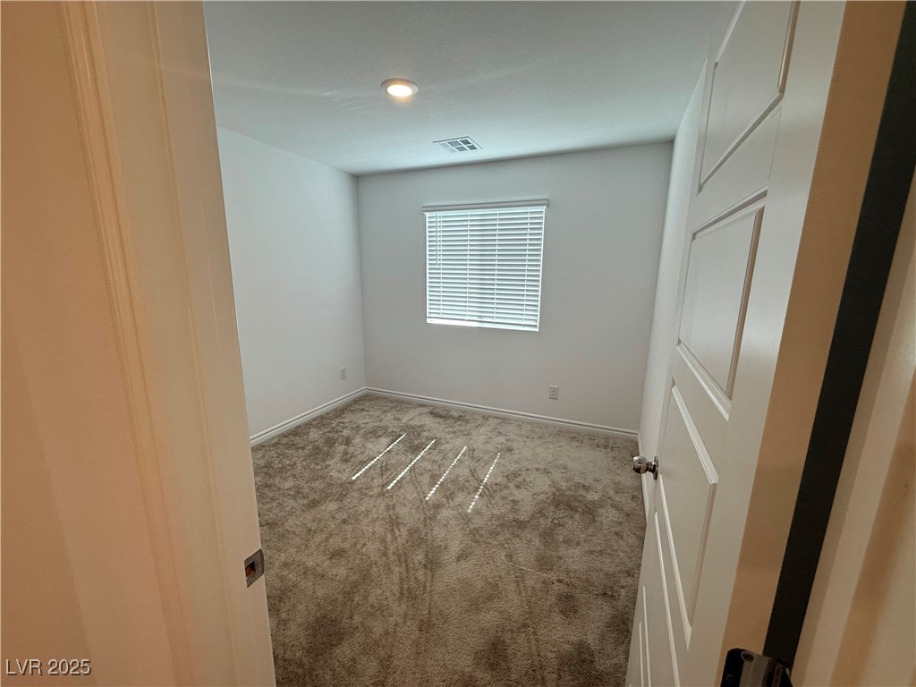 10772 Astell Isle Court Las Vegas, NV 89166 - Photo 19 of 32 Carpeted empty room with baseboards