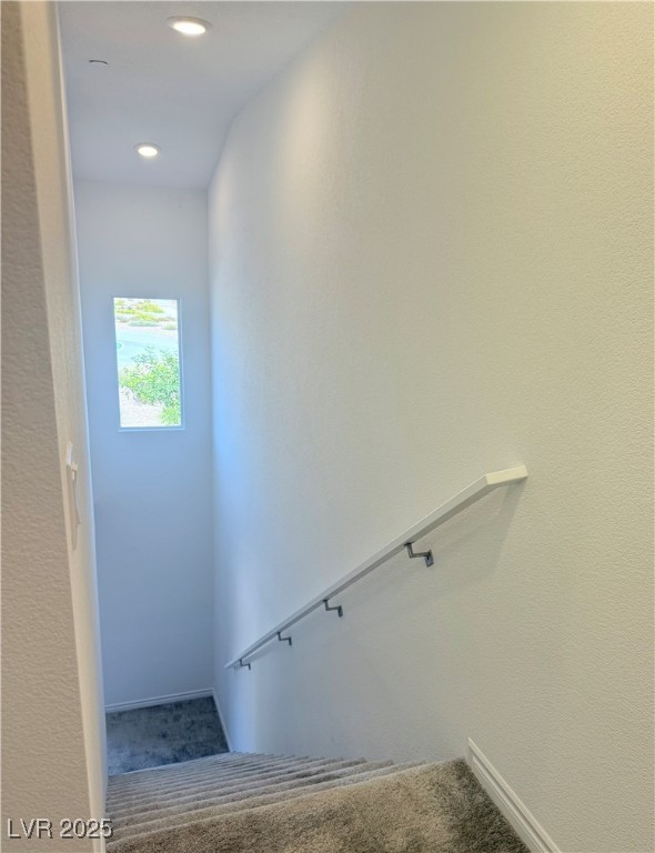 10772 Astell Isle Court Las Vegas, NV 89166 - Photo 30 of 32 Staircase featuring carpet, a textured wall, and recessed lighting