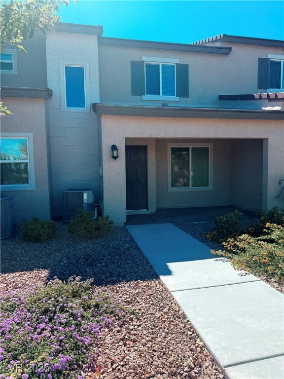 10772 Astell Isle Court Las Vegas, NV 89166 - Photo 32 of 32 View of front of property with a porch and stucco siding