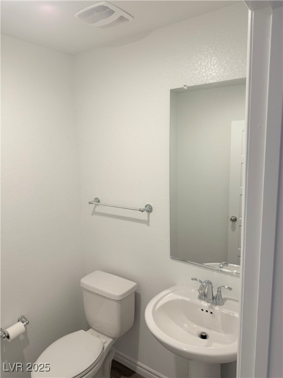 10772 Astell Isle Court Las Vegas, NV 89166 - Photo 9 of 32 Half bathroom/powder room downstairs.