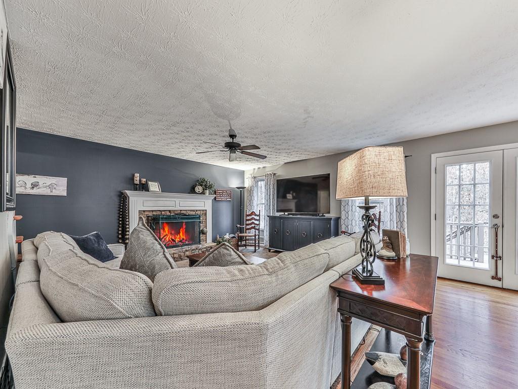 1108 Fieldstone Drive Canton, GA 30114 - Photo 20 of 40 a living room with furniture and a wooden floor