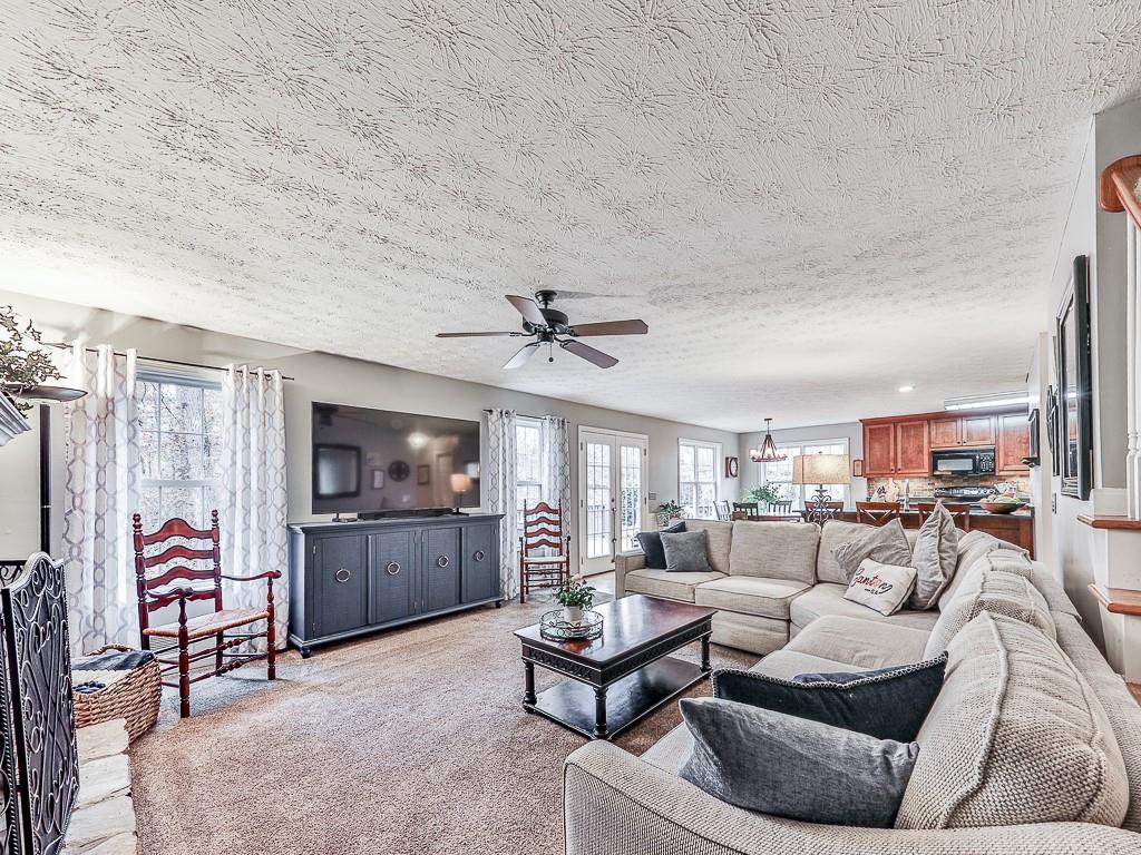 1108 Fieldstone Drive Canton, GA 30114 - Photo 21 of 40 a living room with furniture and a flat screen tv