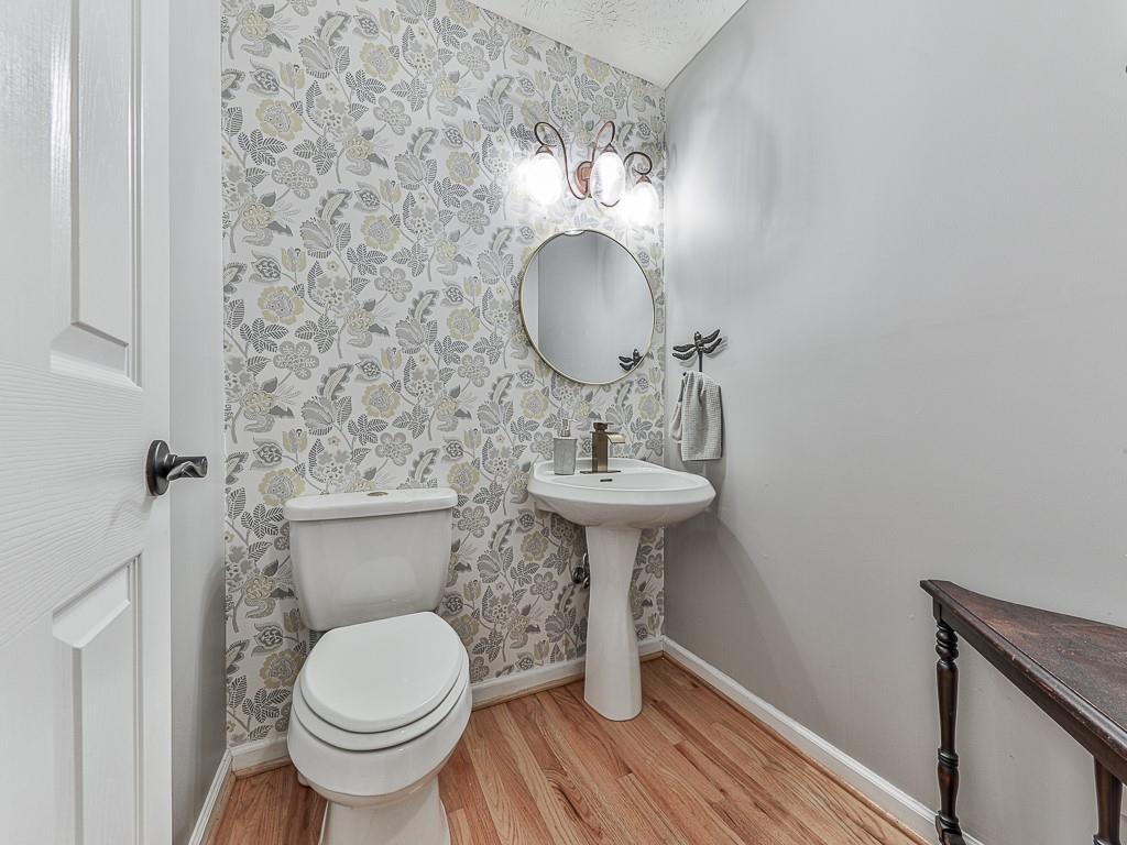1108 Fieldstone Drive Canton, GA 30114 - Photo 24 of 40 a bathroom with a toilet sink and mirror