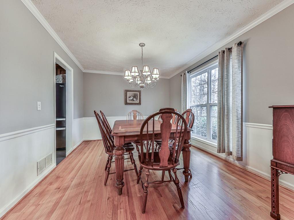 1108 Fieldstone Drive Canton, GA 30114 - Photo 25 of 40 a view of a dining room with furniture window and wooden floor
