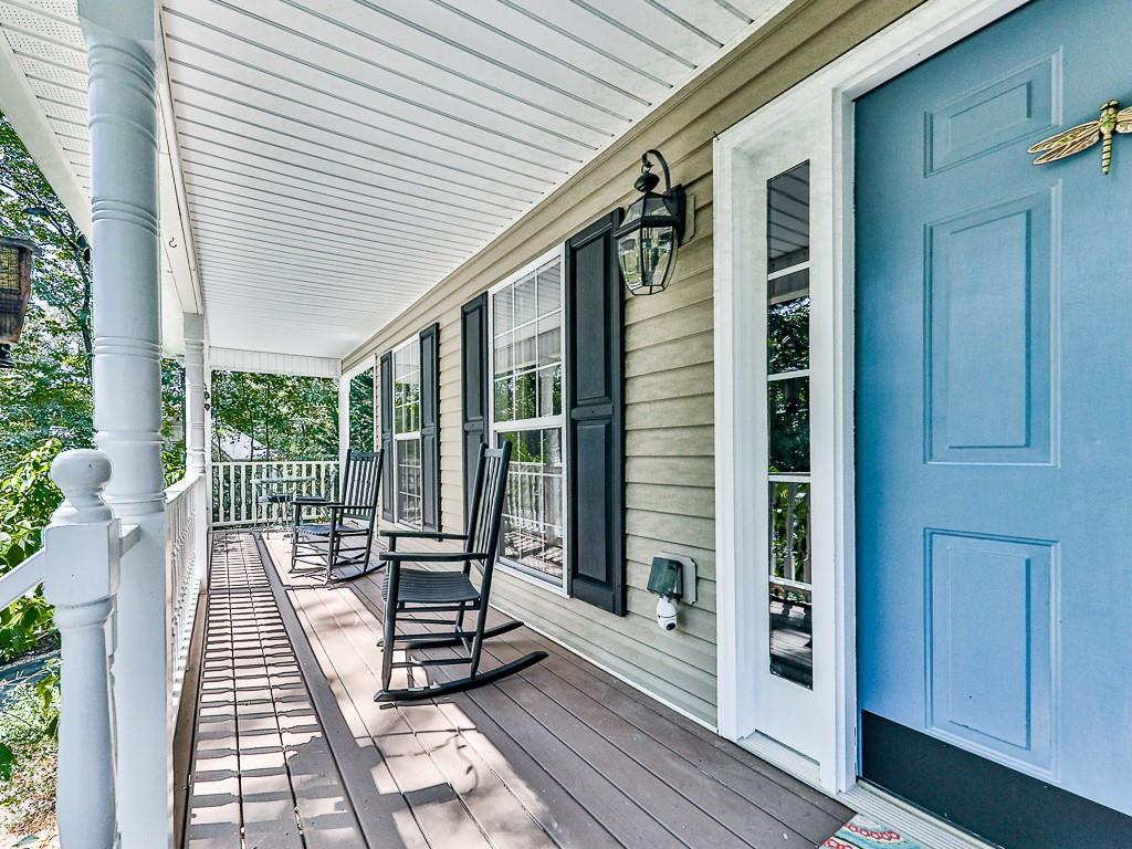 1108 Fieldstone Drive Canton, GA 30114 - Photo 3 of 40 a view of a balcony with floor to ceiling window with wooden floor