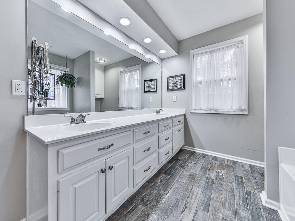 1108 Fieldstone Drive Canton, GA 30114 - Photo 31 of 40 a spacious bathroom with a double vanity sink and a mirror