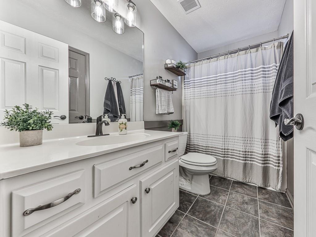 1108 Fieldstone Drive Canton, GA 30114 - Photo 34 of 40 a bathroom with a sink a toilet and shower