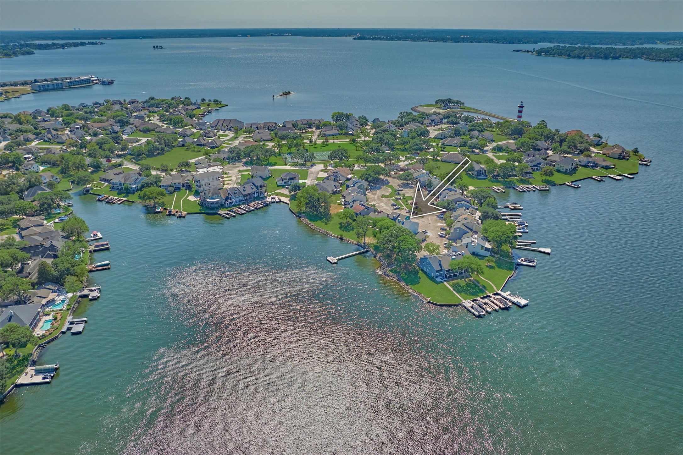 1428 Bowsprit Point Willis, TX 77318 - Photo 5 of 47 A look at the location of the home in relation to the main lake. This home is located in the Harbour Town community which is known for the iconic lighthouse on Lake Conroe, seen beyond in this photo.