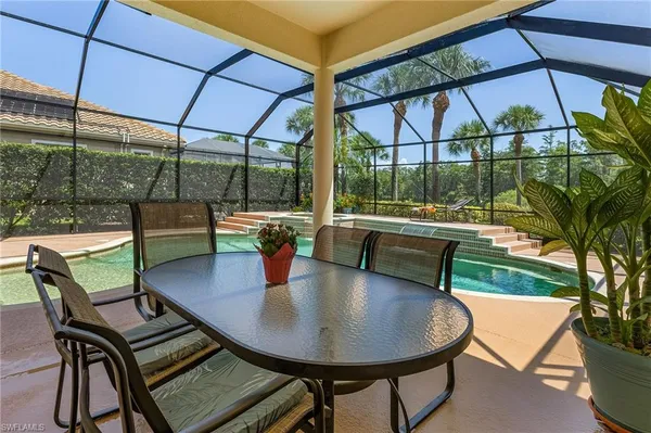 a view of a backyard with sitting area and furniture