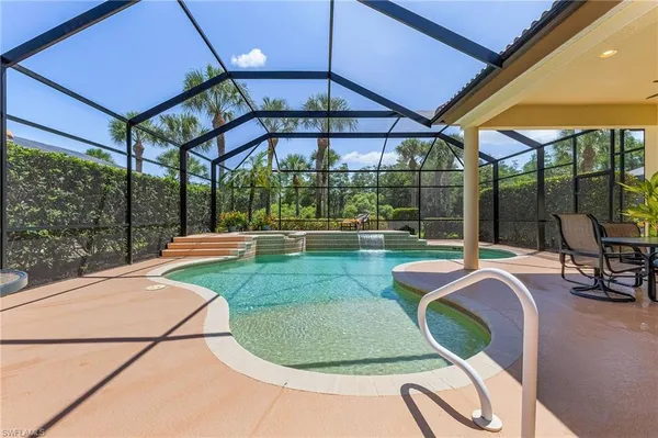 a view of a house with a backyard and a patio