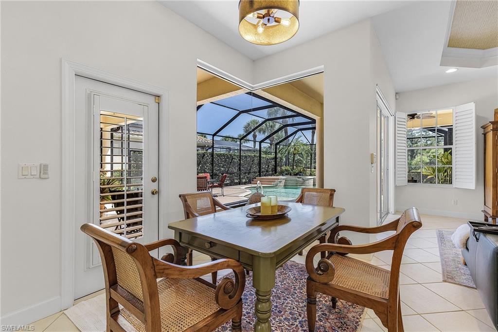 20187 Buttermere Court Estero, FL 33928 - Photo 27 of 40 a view of a dining room with furniture window and outside view