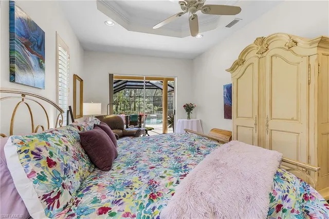 a bedroom with a bed window and couch