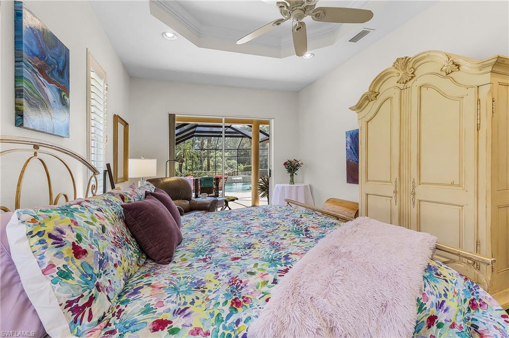 20187 Buttermere Court Estero, FL 33928 - Photo 29 of 40 a bedroom with a bed couch and a window