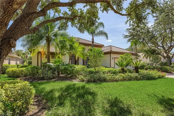 a view of a garden with a house