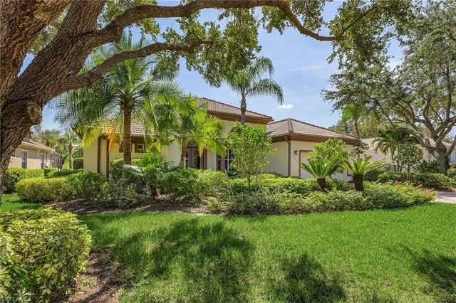 a view of a garden with a house