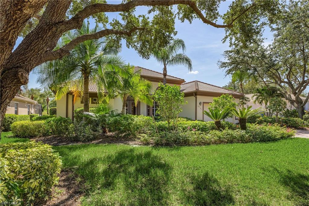 20187 Buttermere Court Estero, FL 33928 - Photo 3 of 40 a view of a garden with a house