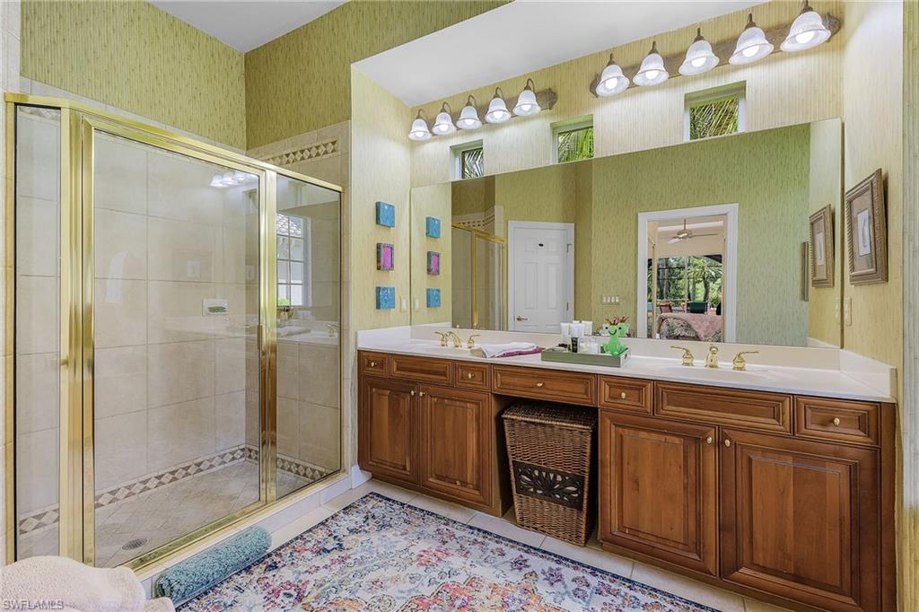 20187 Buttermere Court Estero, FL 33928 - Photo 33 of 40 a spacious bathroom with a double vanity sink mirror and double