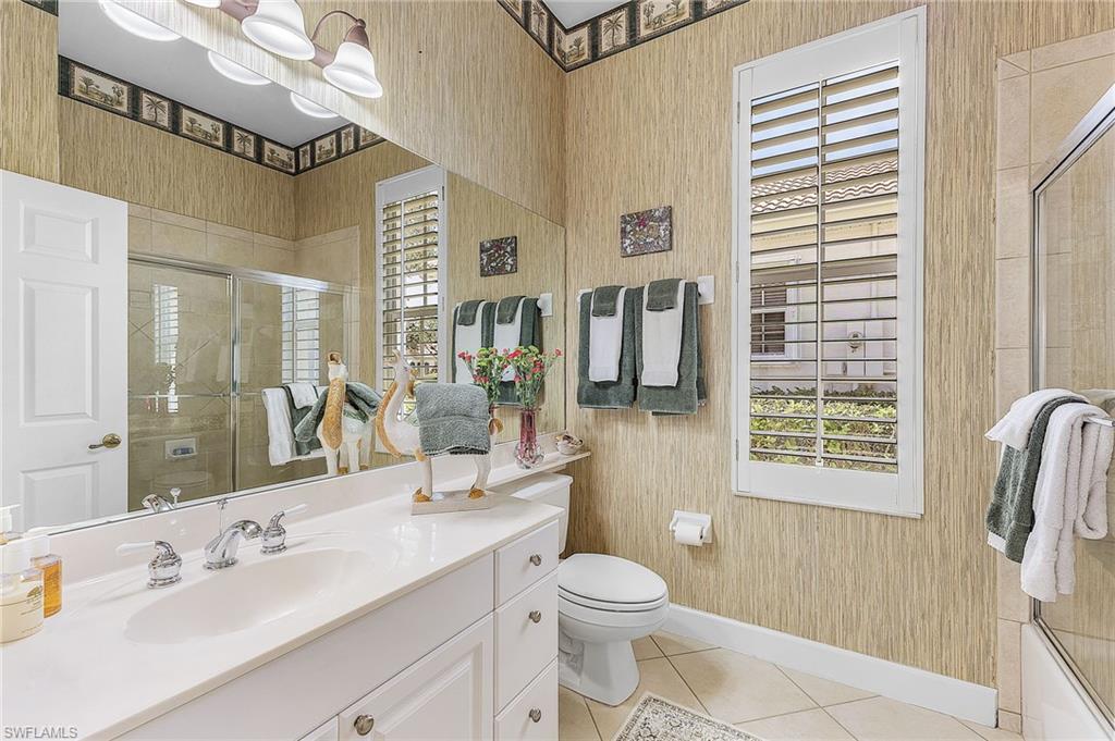 20187 Buttermere Court Estero, FL 33928 - Photo 36 of 40 a bathroom with a granite countertop sink toilet and shower
