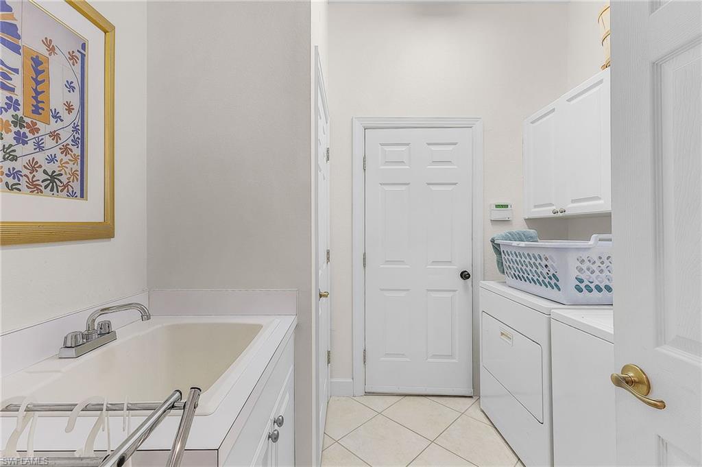 20187 Buttermere Court Estero, FL 33928 - Photo 38 of 40 a bathroom with a sink and a tub