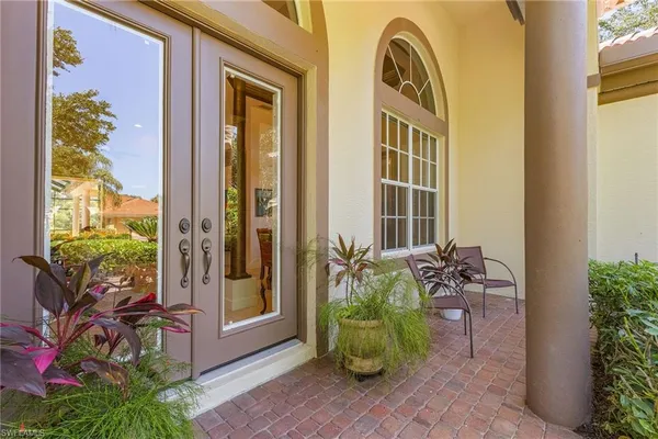 a front view of a house with outdoor seating