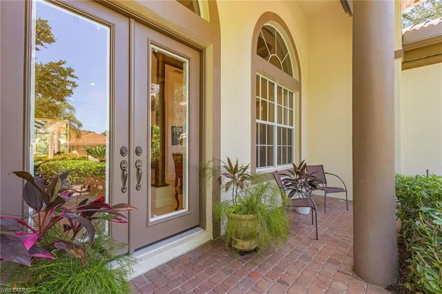 a front view of a house with outdoor seating