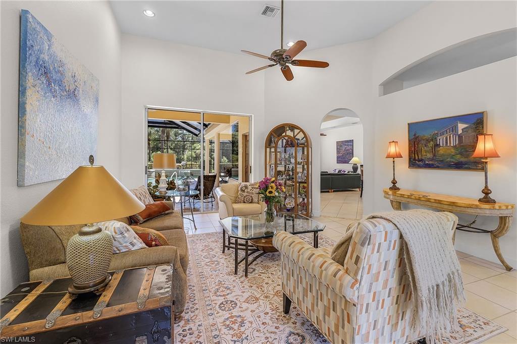 20187 Buttermere Court Estero, FL 33928 - Photo 9 of 40 a living room with furniture ceiling fan and a rug