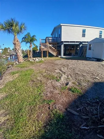 a view of house with outdoor space and sitting area