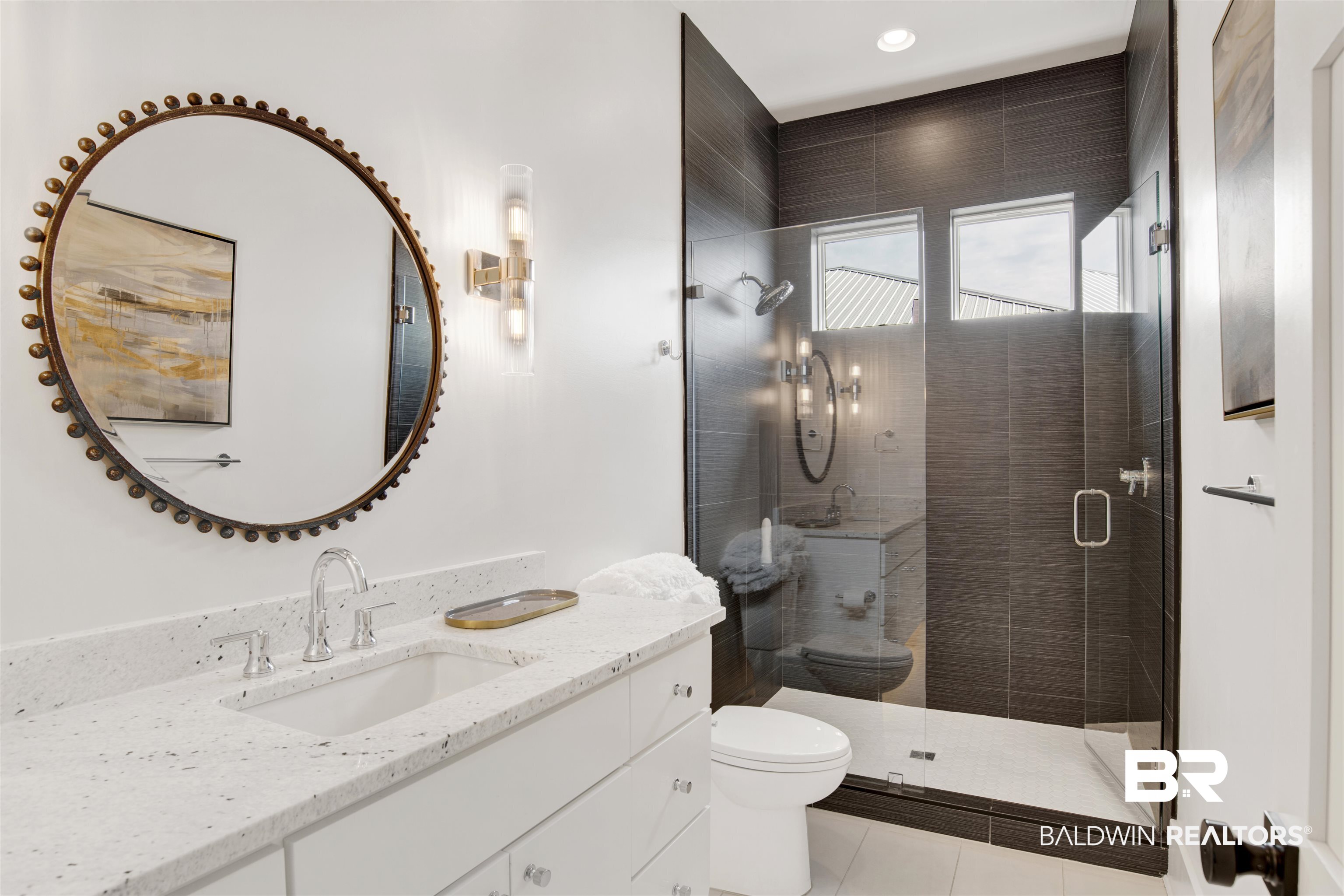 30239 Canal Court Orange Beach, AL 36561 - Photo 43 of 70 Bathroom featuring vanity, a stall shower, and light tile patterned floors