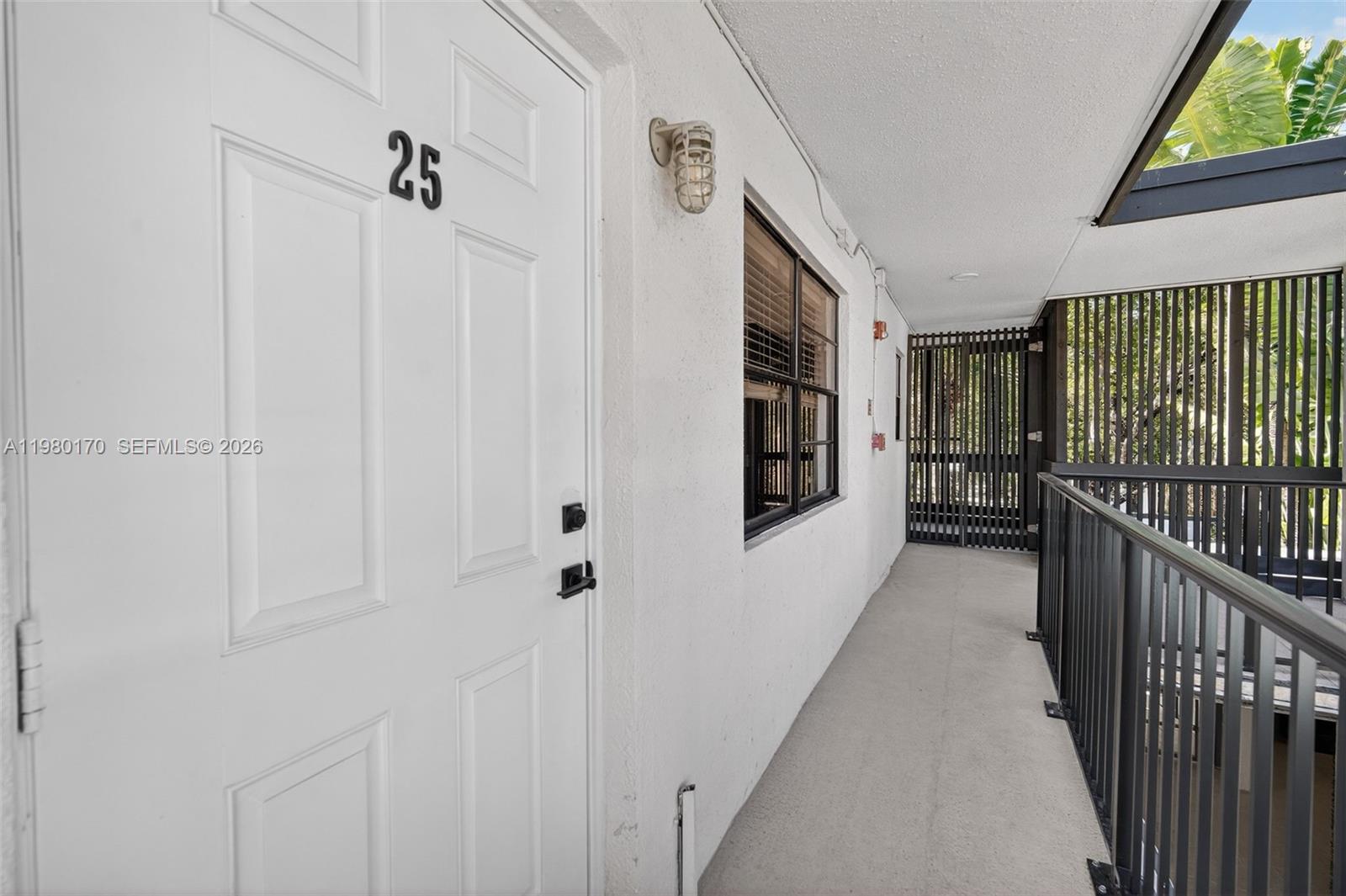 3265 Virginia Street, Unit 25 Miami, FL 33133 - Photo 14 of 28 a view of a hallway with wooden floor and staircase