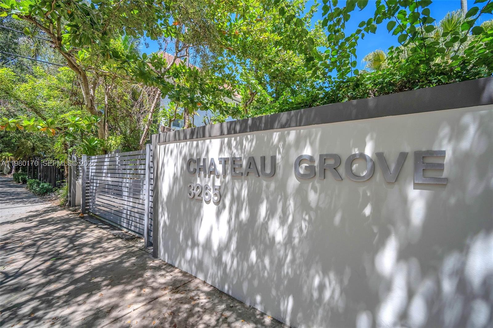 3265 Virginia Street, Unit 25 Miami, FL 33133 - Photo 17 of 28 a view of a wooden fence