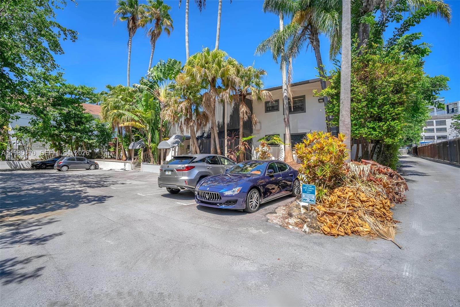 3265 Virginia Street, Unit 25 Miami, FL 33133 - Photo 18 of 28 a car parked in front of a house