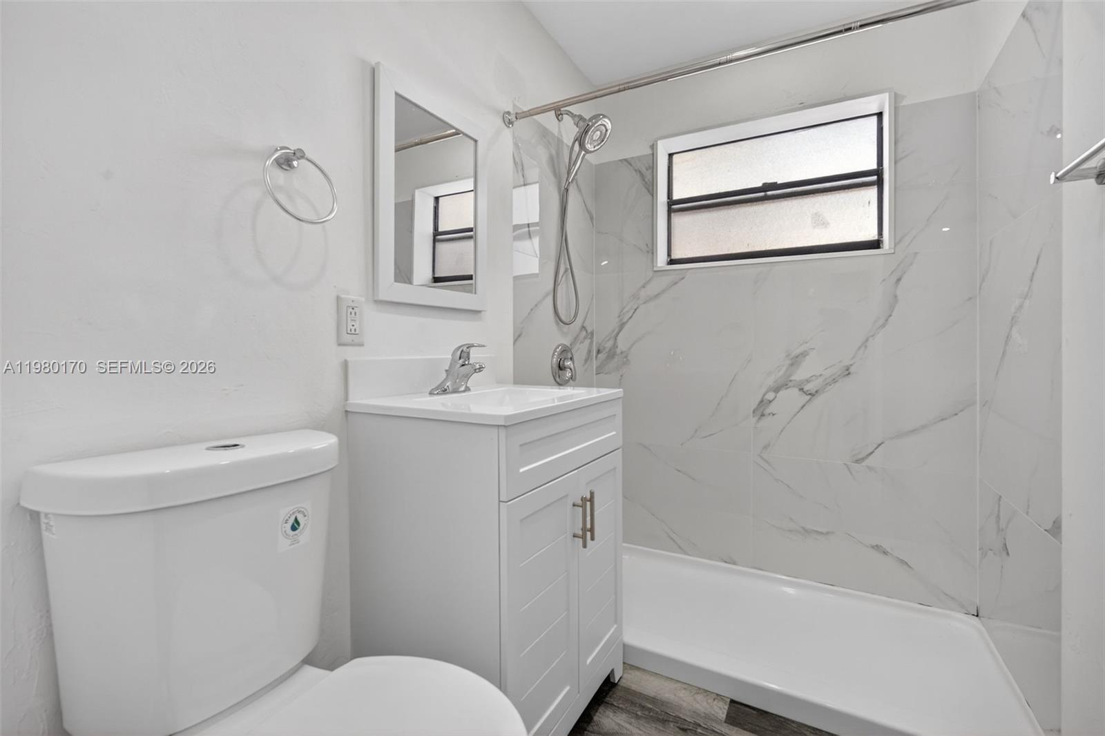 3265 Virginia Street, Unit 25 Miami, FL 33133 - Photo 2 of 28 a bathroom with a sink toilet and shower