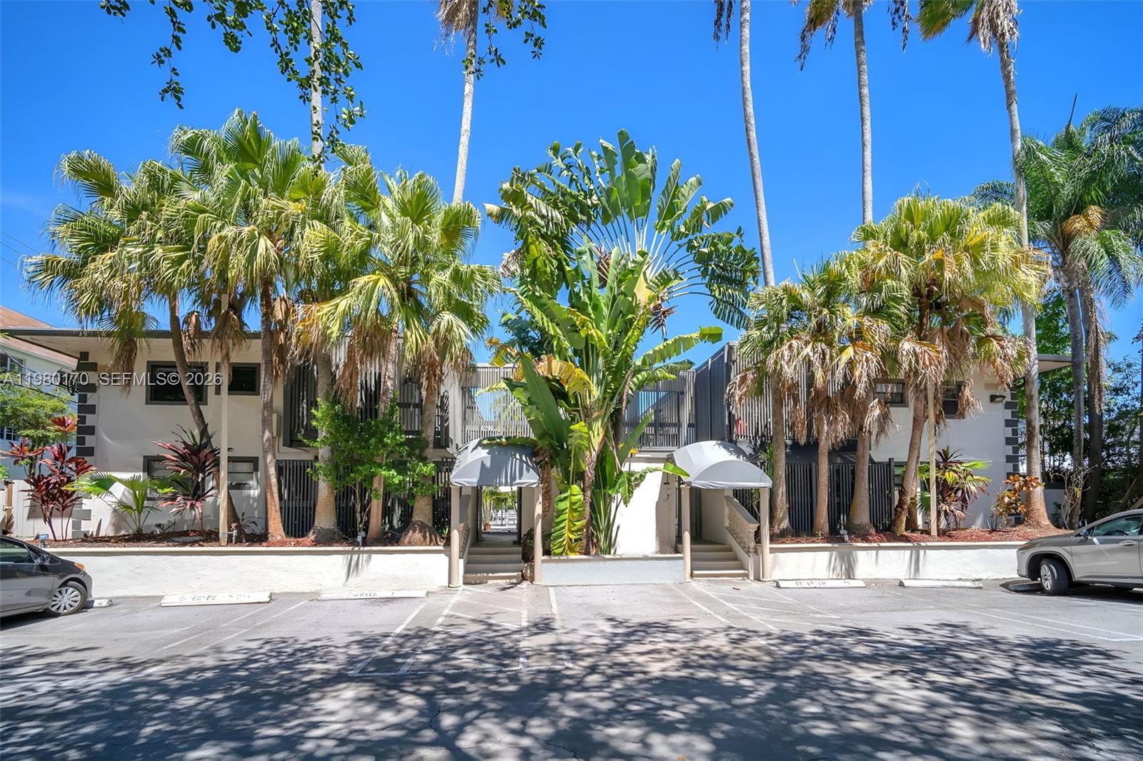 3265 Virginia Street, Unit 25 Miami, FL 33133 - Photo 21 of 28 a view of a street with a building in the background
