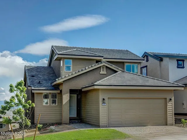 a front view of a house with a garage