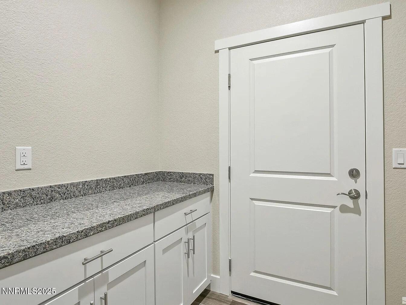 455 Axelson Way Genoa, NV 89411 - Photo 12 of 30 a view of a storage and utility room with granite countertop cabinets