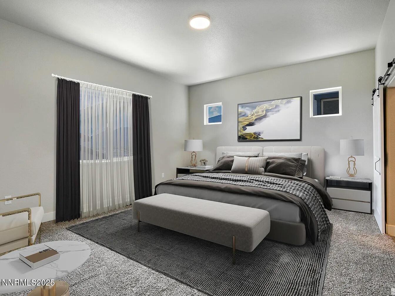 455 Axelson Way Genoa, NV 89411 - Photo 17 of 30 a spacious bedroom with a bed and a couch