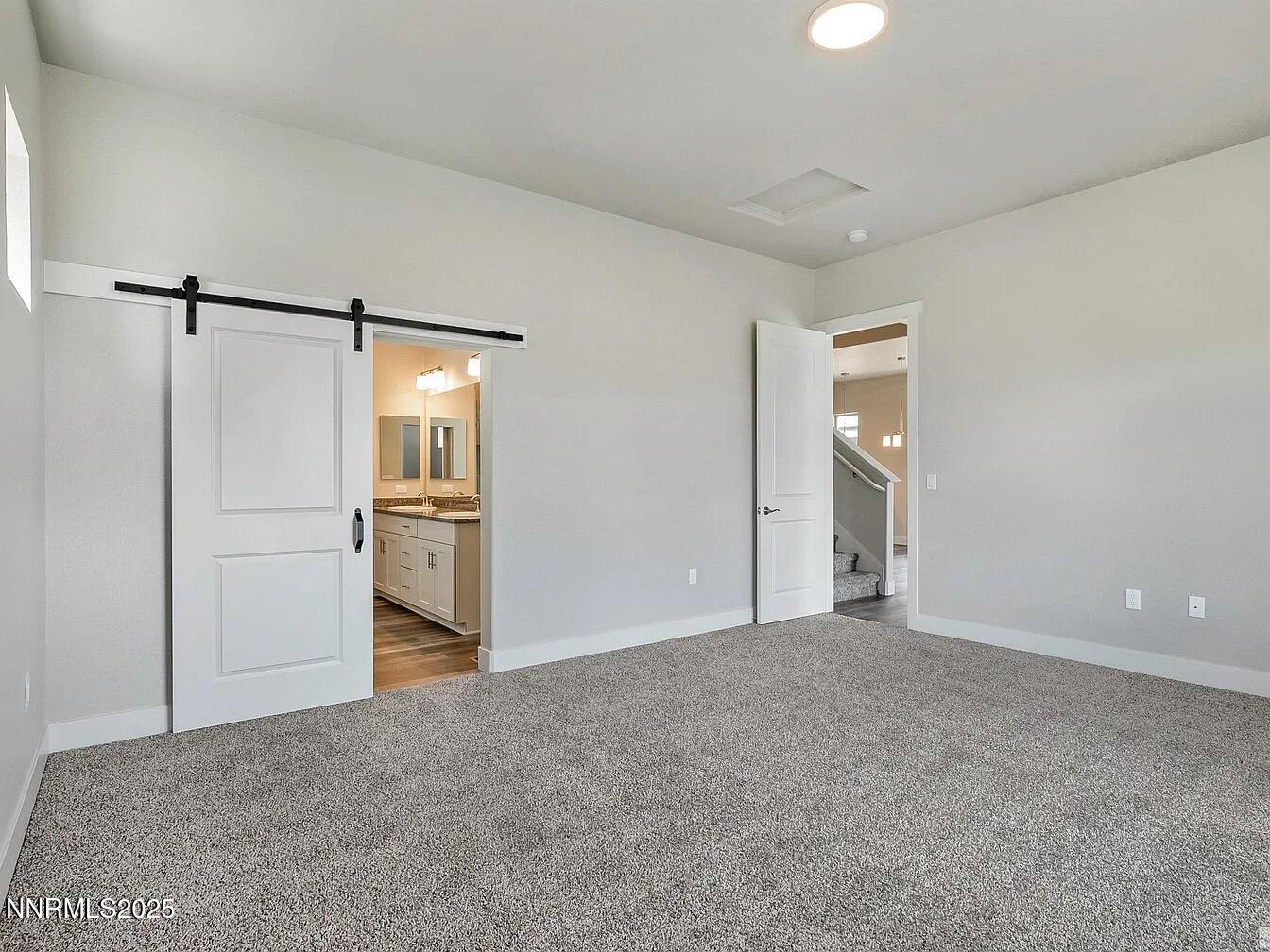 455 Axelson Way Genoa, NV 89411 - Photo 18 of 30 a view of a kitchen with a refrigerator and a stove top oven