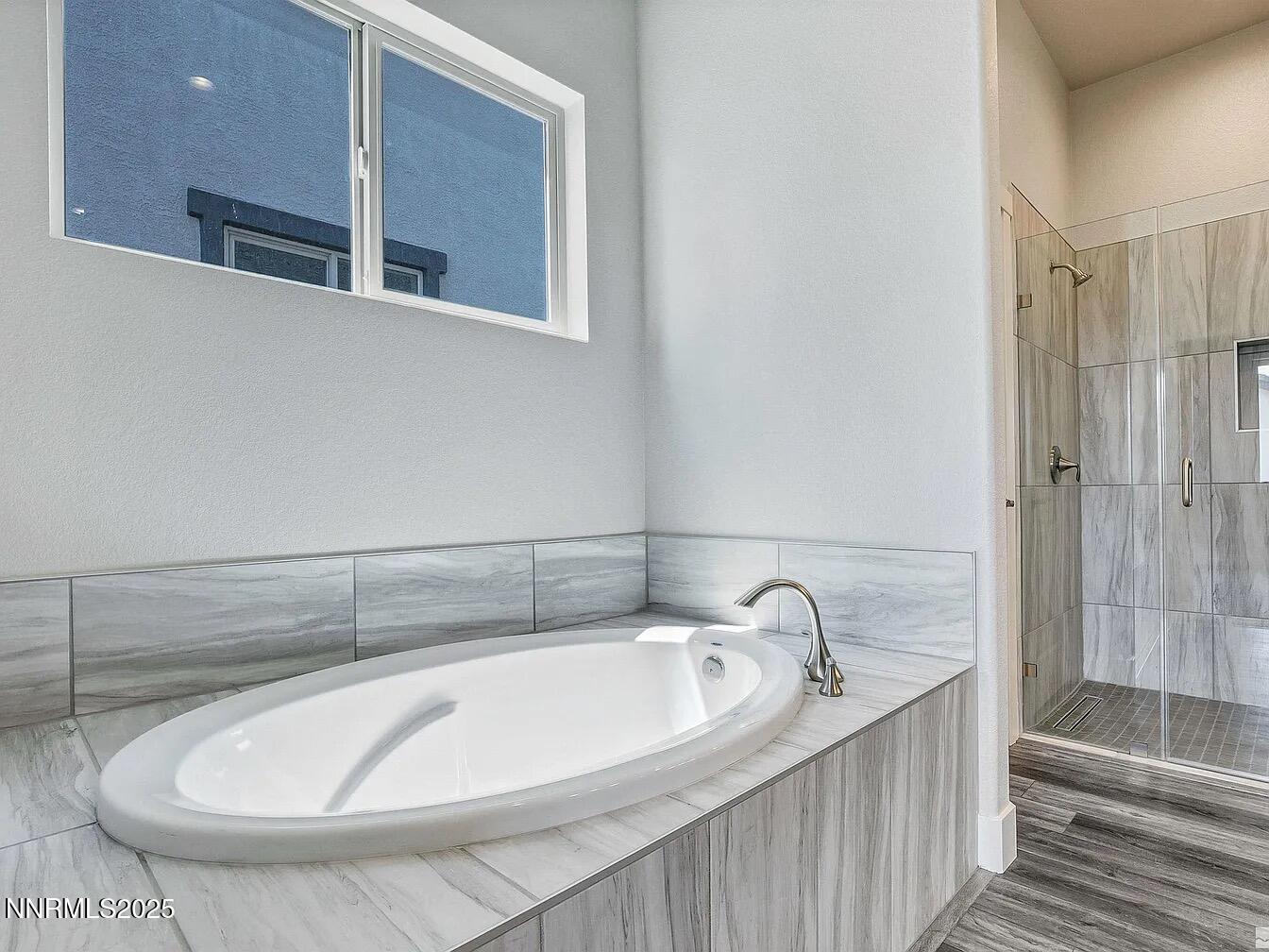 455 Axelson Way Genoa, NV 89411 - Photo 20 of 30 a bathroom with a bathtub and shower