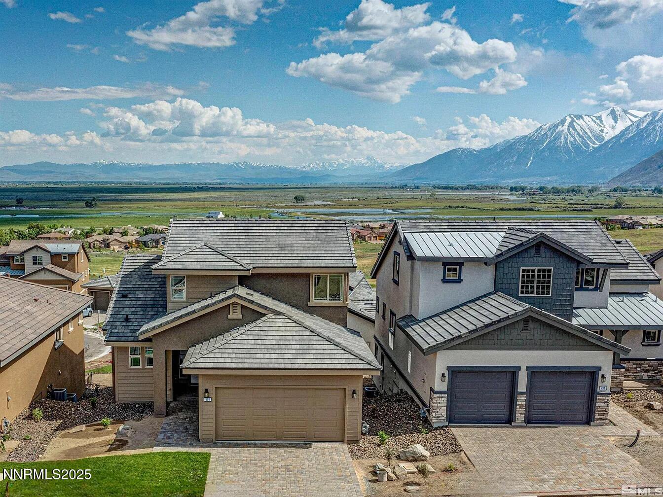 455 Axelson Way Genoa, NV 89411 - Photo 2 of 30 a front view of a house with a yard