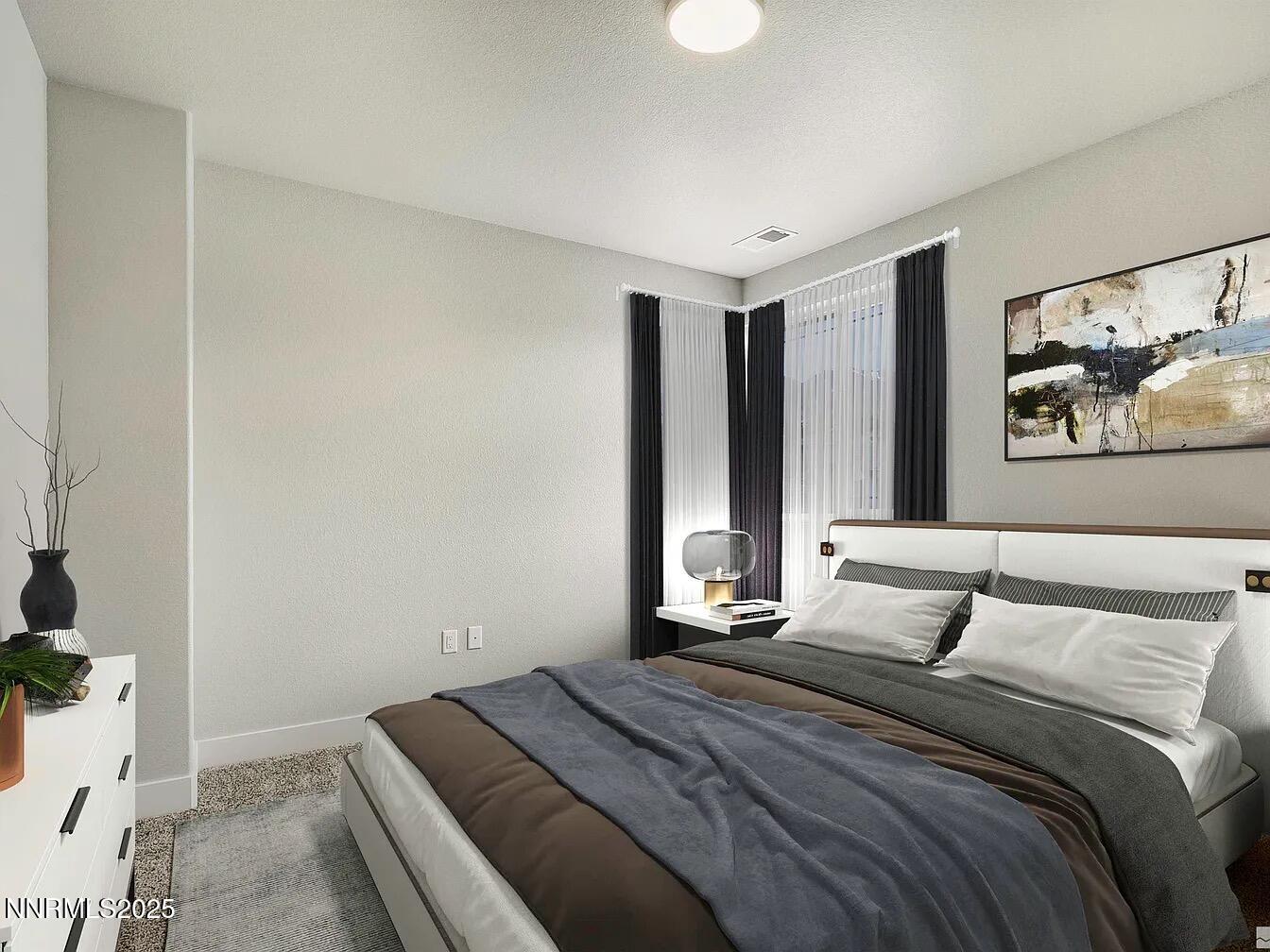 455 Axelson Way Genoa, NV 89411 - Photo 25 of 30 a bedroom with a large bed and a painting on the wall