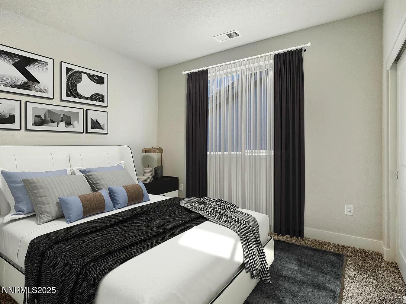 455 Axelson Way Genoa, NV 89411 - Photo 28 of 30 a bedroom with a large bed and closet