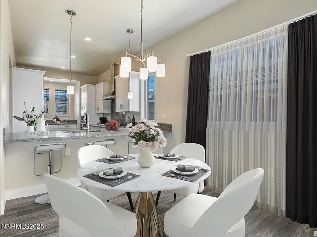 a view of a dining room with furniture window and outside view